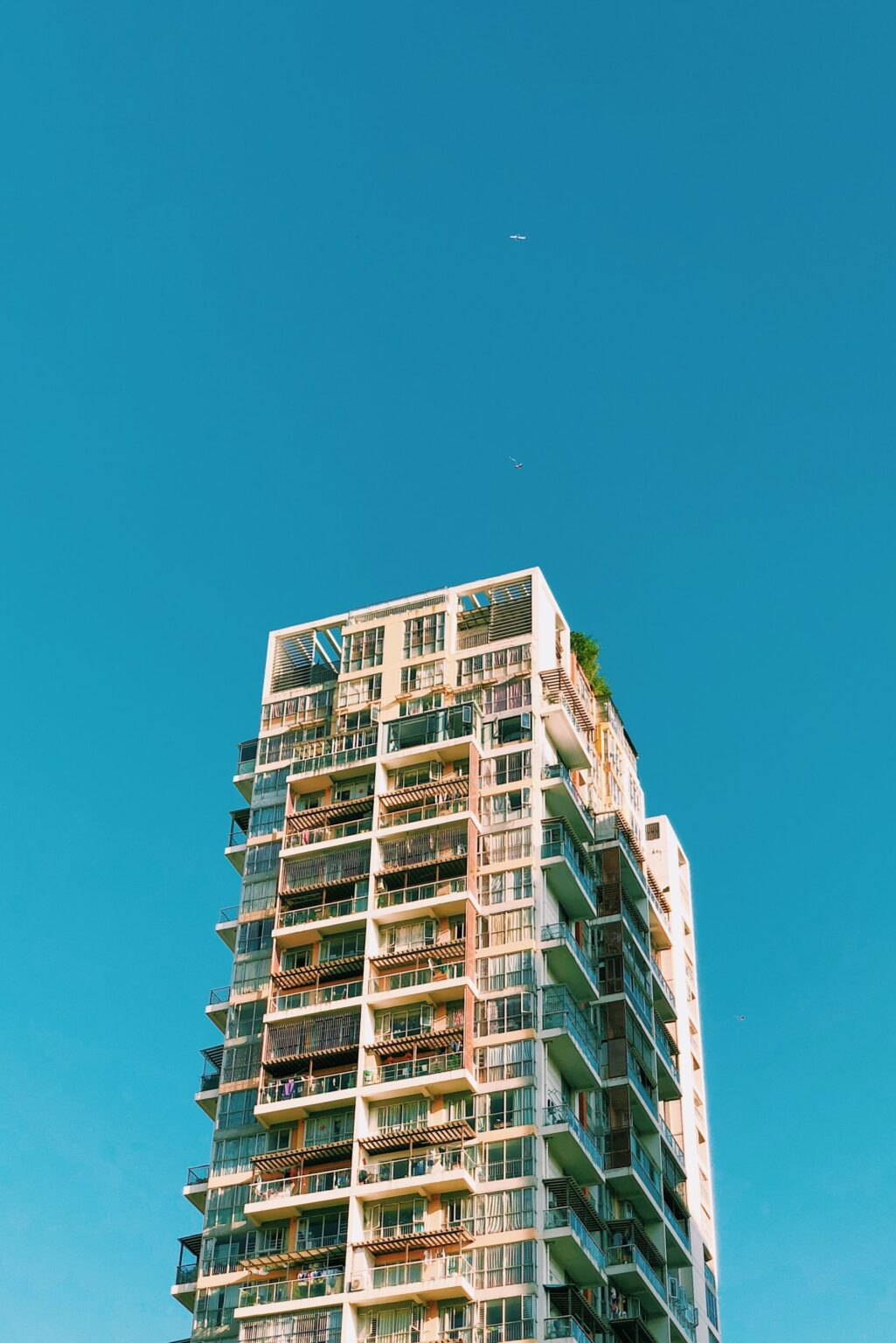 Vertical shot of a building under the blue sky